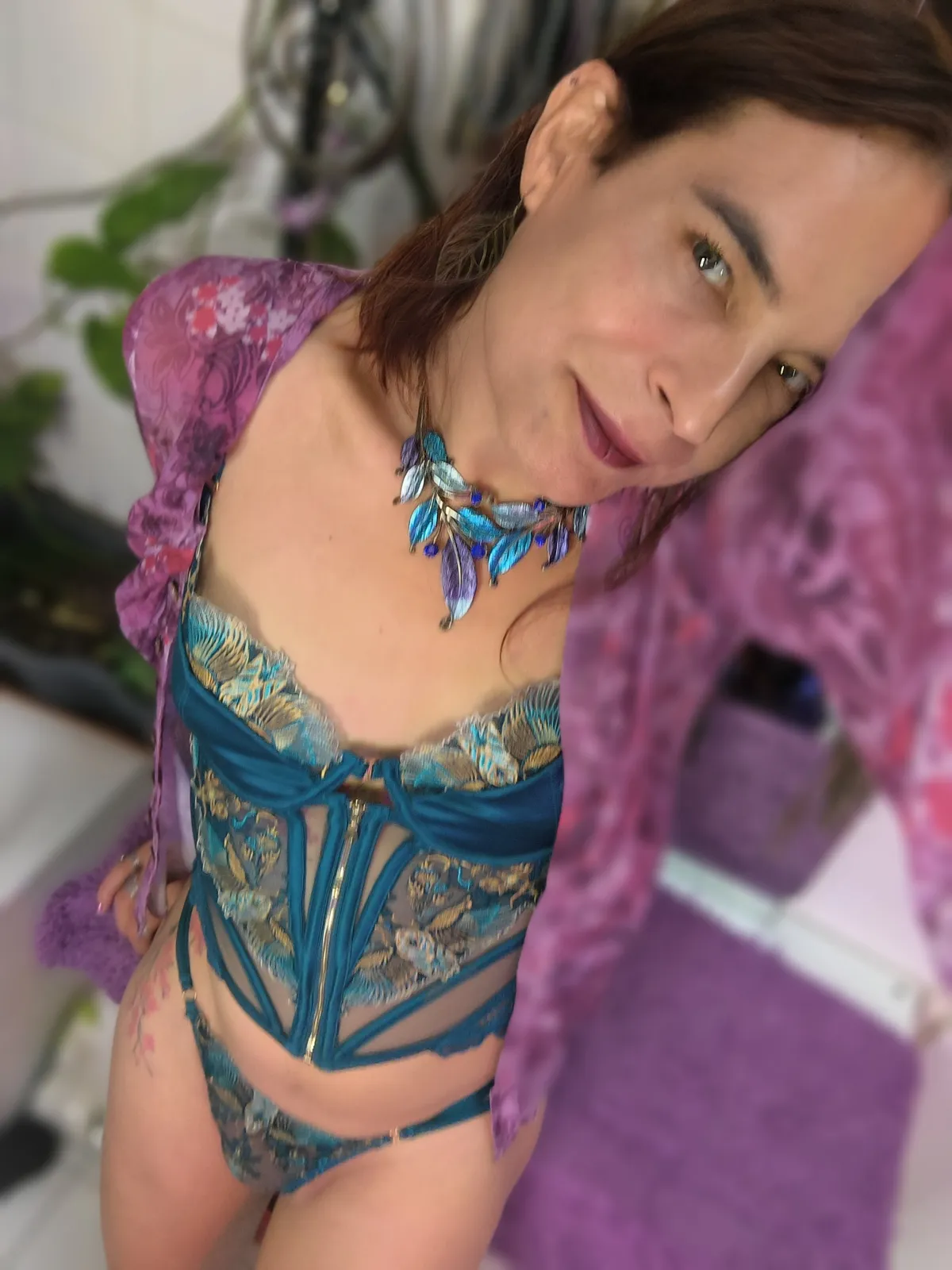 trans escort joy posing with her thristle & spire outfit